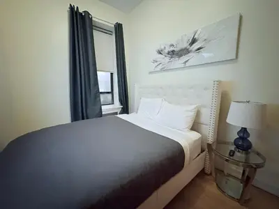 a bedroom with a bed and a window at The Marlow Midtown in New York