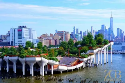 a long row of buildings in the water with a city at Gorgeous and Fully Equipped Luxury 1 Bedroom Apt in New York