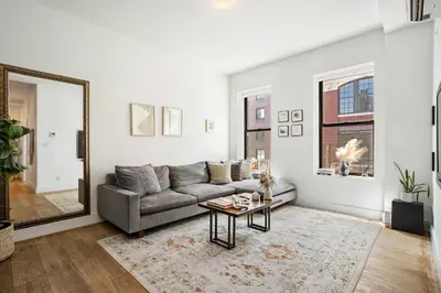 a living room with a couch and a table at Beautiful and Spacious 2 Bed 2 Bath Apt - Elevator in New York