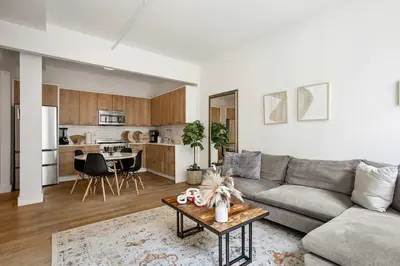 a living room with a couch and a table at Beautiful and Spacious 2 Bed 2 Bath Apt - Elevator in New York