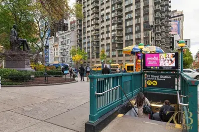 a group of people riding a ride in a park at Modern 2BR Terrace WD & Elevator in NoMad in New York