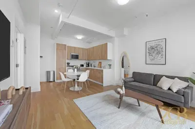 a living room with a couch and a table at Beautifully Renovated 1 bedroom in Prime Manhattan in New York