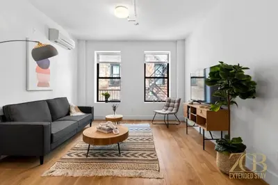 a living room with a couch and a table at Fabulous 1 Bedroom in the Heart of Manhattan in New York