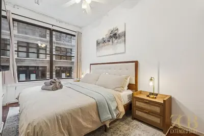 a bedroom with a large bed and a window at Spacious 3BR Flex 4 with Washer & Dryer in NoMad in New York