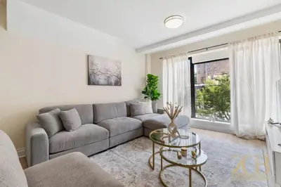 a living room with a couch and a table at Chic 3BR 2BA West Village Apt with Private Oasis in New York