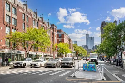 a busy city street with cars parked on the street at Chic 3BR 2BA West Village Apt with Private Oasis in New York