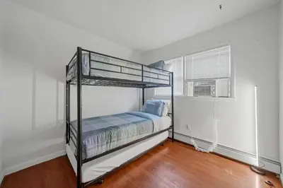 a bedroom with two bunk beds and a window at Highland Estates, 5 Private Units for 1 Group! in Monticello