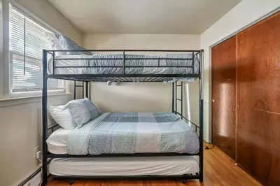 a bedroom with two bunk beds in a room at Highland Estates, 5 Private Units for 1 Group! in Monticello