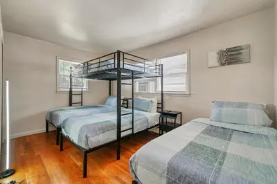a bedroom with two beds and a bunk bed at Highland Estates, 5 Private Units for 1 Group! in Monticello