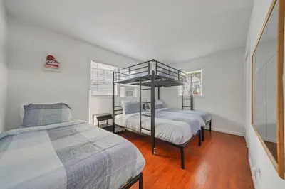 a bedroom with two beds and a bunk bed at Highland Estates, 5 Private Units for 1 Group! in Monticello