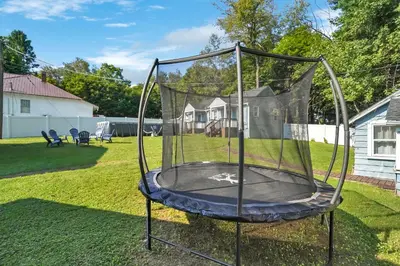 a trampoline in the backyard of a yard at Highland Estates, 5 Private Units for 1 Group! in Monticello