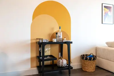 a black table with a bottle of wine on it at Luxury Stay Near NYC | Full Access to Amenities in Newark