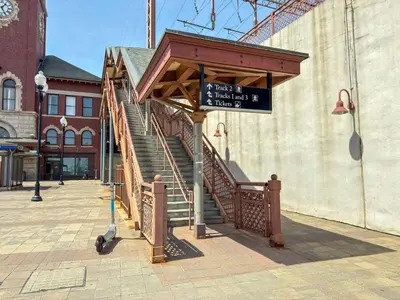 a stairway with a sign in front of a building at Luxury Stay Near NYC | Full Access to Amenities in Newark
