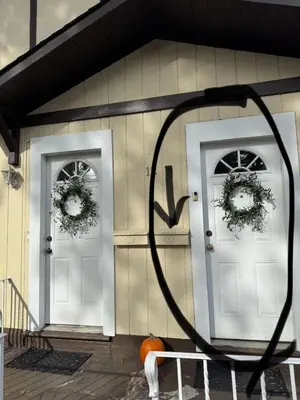 two white doors on a house with wreaths on them at Cozy room with Queen bed 20 min to NYC in Ridgefield Park