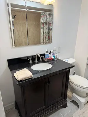 a bathroom with a sink and a toilet at Cozy room with Queen bed 20 min to NYC in Ridgefield Park