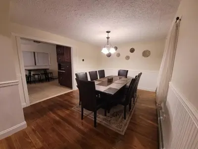 a dining room with a table and chairs at Cozy 4 Bedrooms Pool Game Room in Tobyhanna