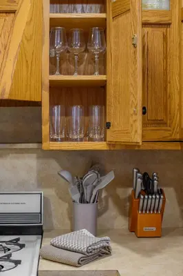 a kitchen counter with wine glasses and utensils at All-American classic,18 min to Manhattan in Carlstadt