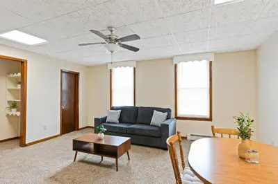 a living room with a couch and a table at Classic American-style, 18 min to NYC in Carlstadt