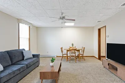 a living room with a couch and a table at Classic American-style, 18 min to NYC in Carlstadt