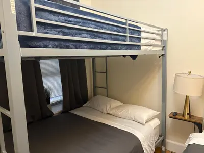 a bedroom with a bunk bed with a bunk bedsheet at Signature by Times Square in New York