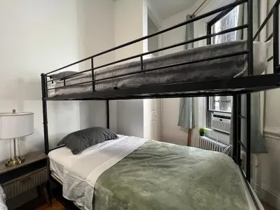 a bedroom with a bunk bed in a room at Parkline Suites Upper West Side in New York