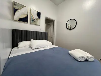 a bedroom with a bed with two towels on it at Parkline Suites Upper West Side in New York