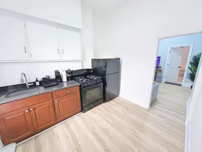 a kitchen with a stove and a sink at PATHside 1BR Quick Access to NYC in Hoboken