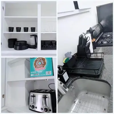 a kitchen with a sink and a counter top with a kitchenilit at PATHside 1BR Quick Access to NYC in Hoboken