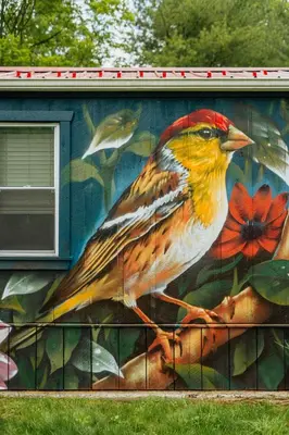 a painting of a bird on the side of a building at Mural Art Cabin With Pond And Hot Tub in Narrowsburg