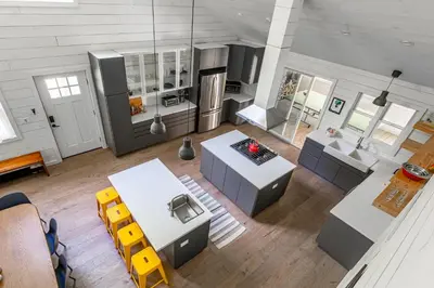 an overhead view of a kitchen and living room at Hare & Hollow with Hot Tub & Fenced Yard