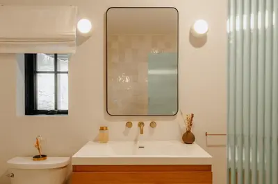 a bathroom with a sink and a mirror at Onyx Ridge Breathtaking Views 14 Acres in Jeffersonville