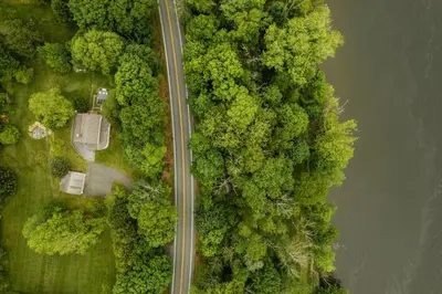 an overhead view of a road next to a river at Roebling House 1850s Cabin Hot Tub Fire Pit in Barryville