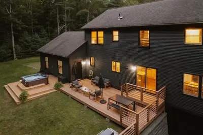 an aerial view of a house with a deck at Woods Edge Private 5 Acres Hot Tub Fire Pit in Barryville