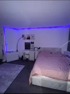 a bedroom with a bed with a purple lighting at LOFT IN WITH ALL AMENETIES BUILDING BEST LOCATION IN MIDTOWn in New York