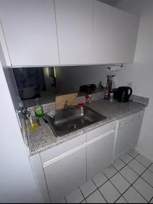 a kitchen with a sink and a counter top at LOFT IN WITH ALL AMENETIES BUILDING BEST LOCATION IN MIDTOWn in New York