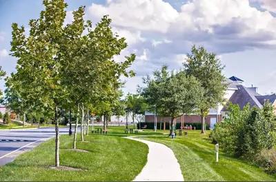 a park with trees on the side of a road at A private master room in modern complex shared apartment in Lawrenceville