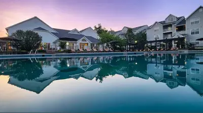 a group of houses and a pool of water at A private master room in modern complex shared apartment in Lawrenceville
