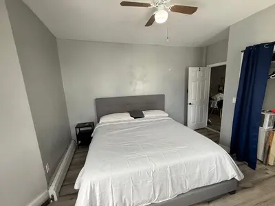 a bedroom with a bed and a ceiling fan at EWRBNB - Private Bedroom in Well sized Shared Apartment - 1 in Elizabeth