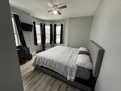 a bedroom with a bed and a ceiling fan at EWRBNB - Private Bedroom in Well sized Shared Apartment - 1 in Elizabeth