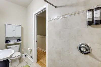 a bathroom with a toilet and a sink at Spectacular 5BAand2BA Group Getaway in Philly! in Philadelphia