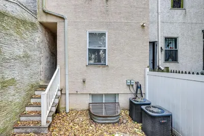 a house with two trash cans in front of it at Spacious 4BRand2BA Family Retreat in Philadelphia in Philadelphia