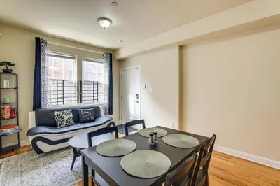 a dining room with a table and chairs and a couch at Spacious 4BRand2BA Family Retreat in Philadelphia in Philadelphia