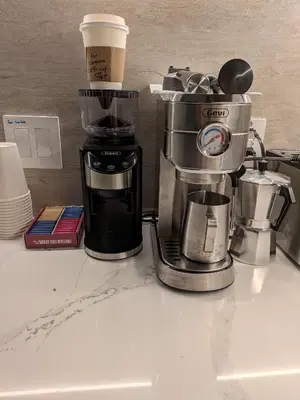 a coffeemaker and a coffee maker on a counter at The Cosmo Outstand NYC - Private Room near Times Square in New York