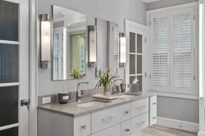 a white bathroom with two sinks and mirrors at Luxury Princeton Estate Pool, Hot Tub, Sleeps 20 in Princeton