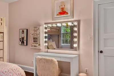a bedroom with a mirror and a dressing table at Luxury Princeton Estate Pool, Hot Tub, Sleeps 20 in Princeton