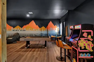 a gaming room with a pool table and a game system at Golf Sim, Game-Movie Room, Spa, Sauna, Arcade ! in Tobyhanna