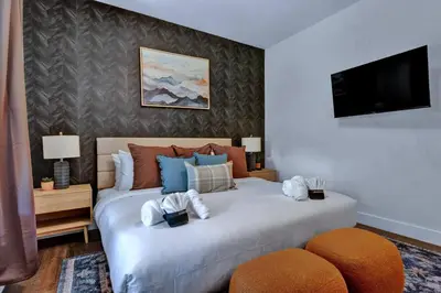 a bedroom with two beds with towels on them at Golf Sim, Game-Movie Room, Spa, Sauna, Arcade ! in Tobyhanna