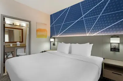 a large white bed in a hotel room at Comfort Inn in Staten Island