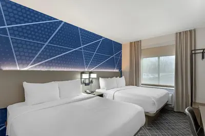 two beds in a hotel room with blue ceilings at Comfort Inn in Staten Island