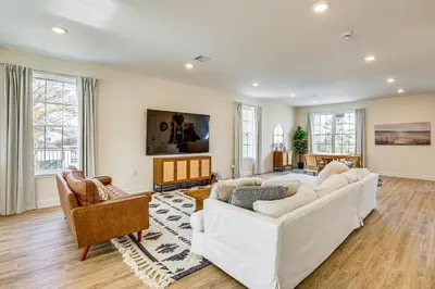 a living room with a white couch and chairs at Walk to Keansburg Beach! Family Home with Pool in Keansburg